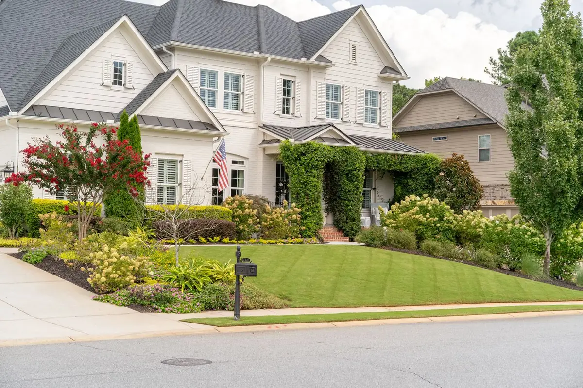 Estate front lawn and layered plantings with full curb appeal.