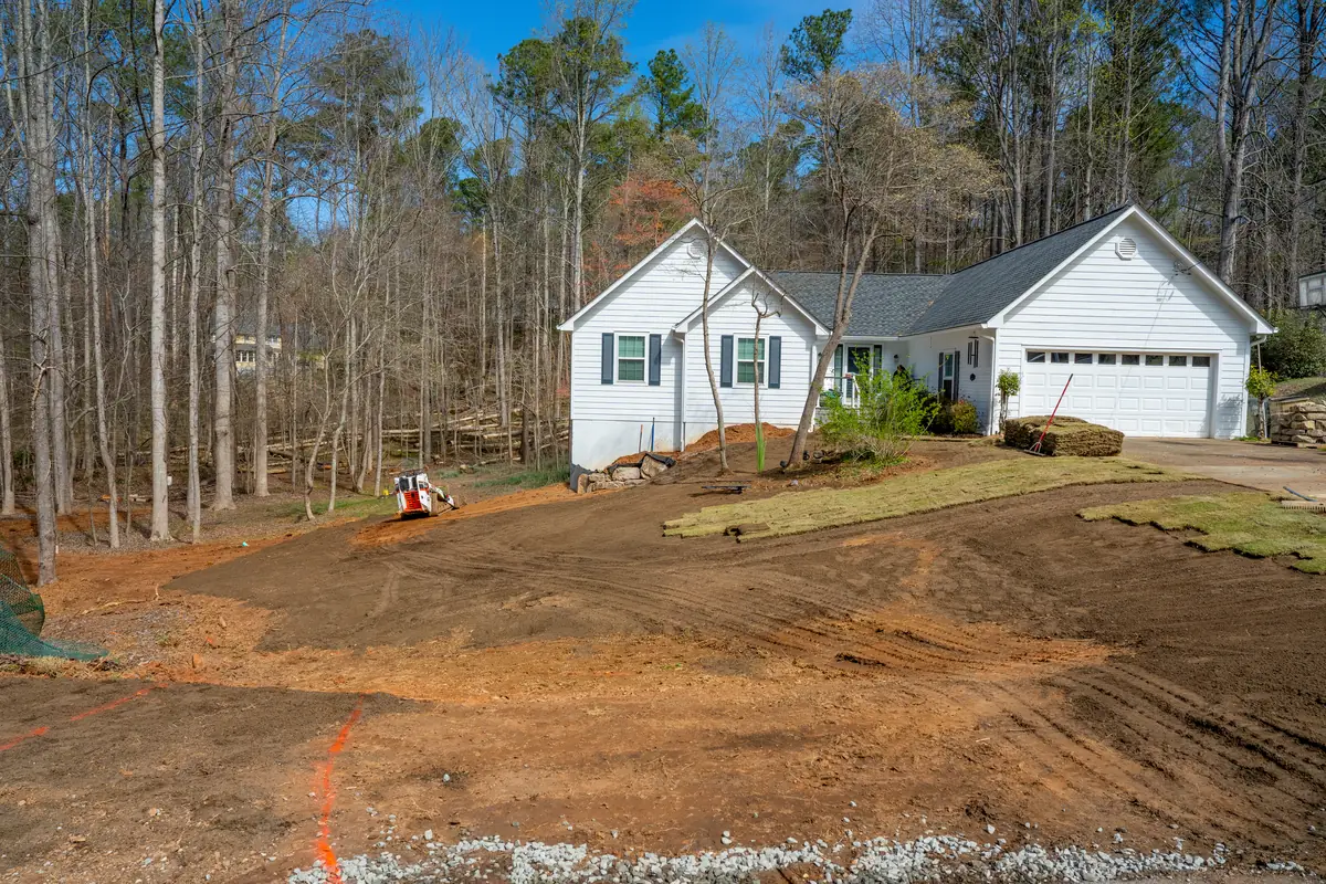 Freshly graded front yard shaped and contoured, ready for a new lawn